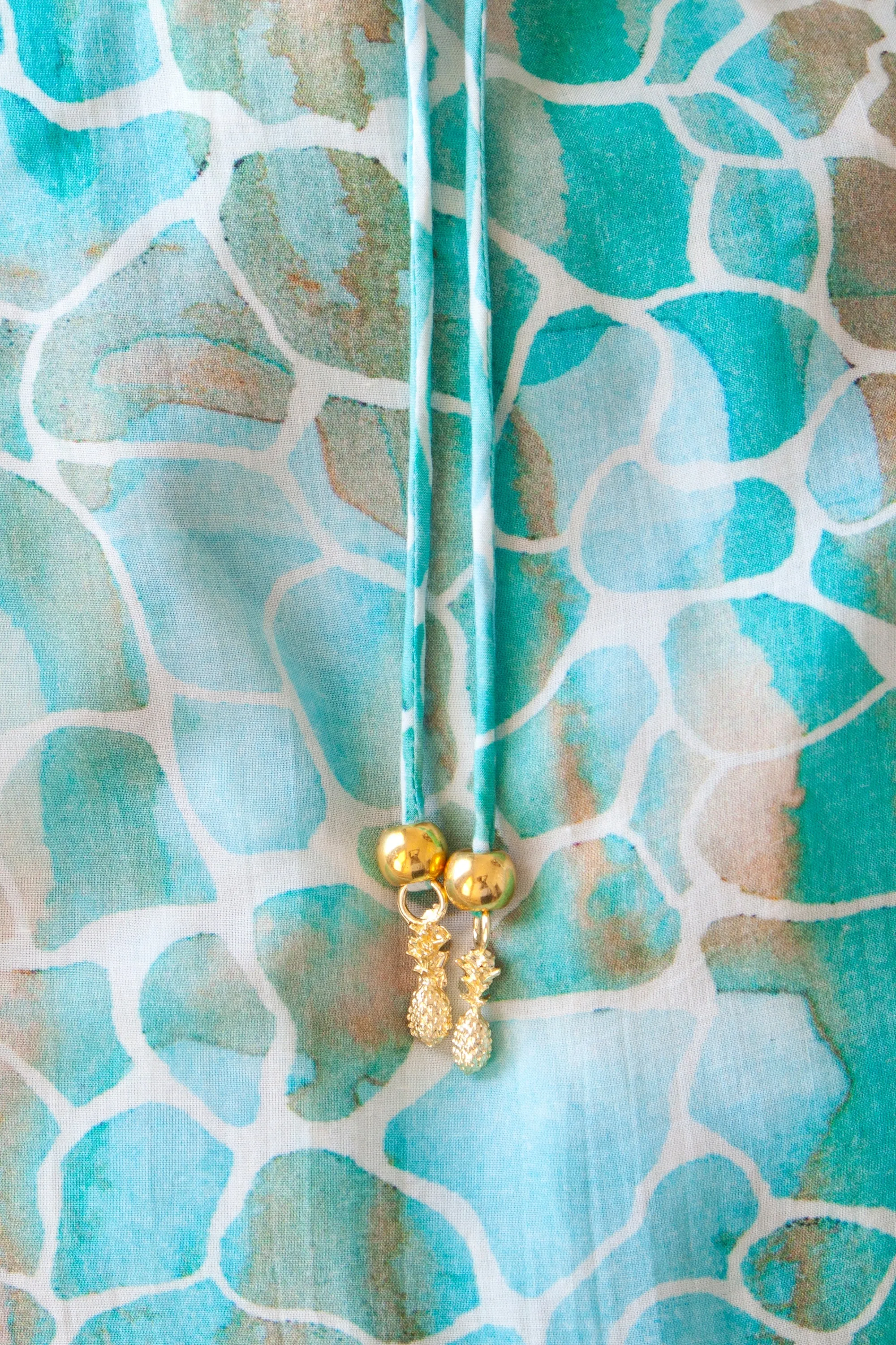 AQUA PEBBLES MINI RUFFLE WRAP DRESS